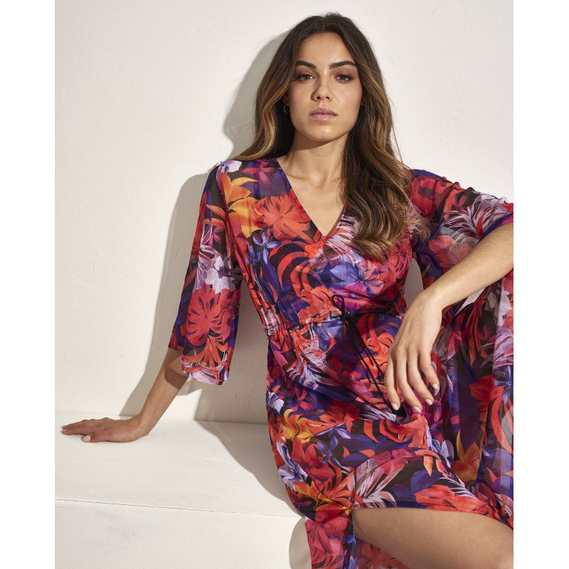 Vestido largo playero estampado floral sobre fondo negro SELMARK