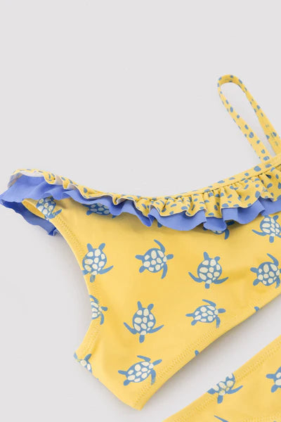 Bikini niña asimétrico detalle volantes estampado tortugas Ysabel Mora