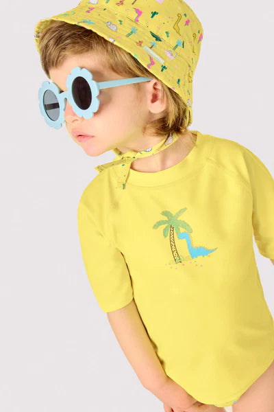 Camiseta de baño bebé dibujo dinosaurio y palmera amarillo Ysabel Mora